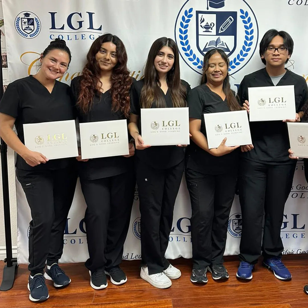 A group of five individuals dressed in black scrubs pose confidently in front of an LGL College banner, each displaying their Wound Care Certificate from the intensive online class. With varied hairstyles and broad smiles, they celebrate their accomplishments during this graduation ceremony.